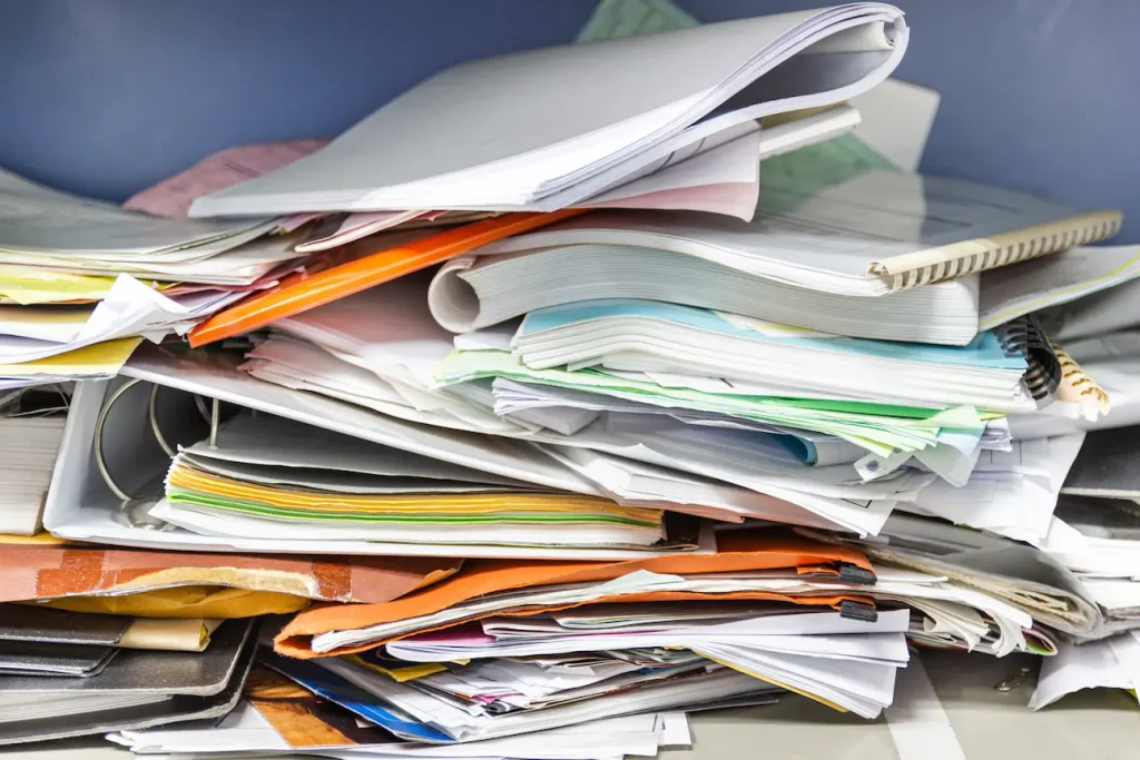 Messy file document and Office Supplies in filing cabinets at work office