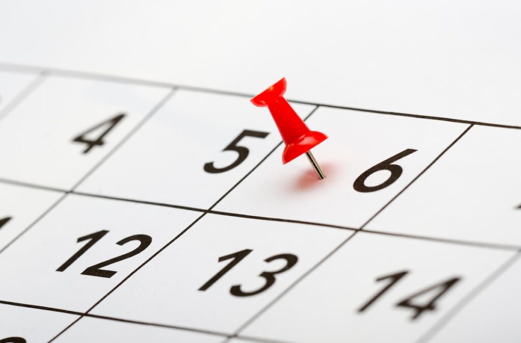 A simple monthly calendar with softly highlighted dates representing steady organisation.